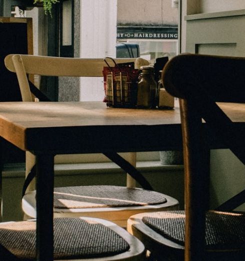 Co-Founder - An Empty Table Standing in Sunlight in a Cafe