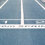 Goals - Close-up of outdoor 100m sprint track lanes, perfect for athletics and sprinting events.