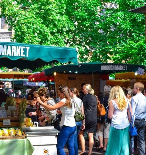 Market - Lively scene at Borough Market in London, filled with people shopping and enjoying the atmosphere.