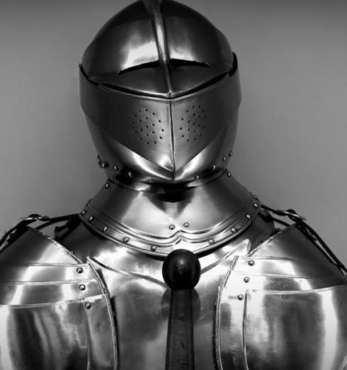 Protection - Close-up shot of vintage medieval knight armor in monochrome.