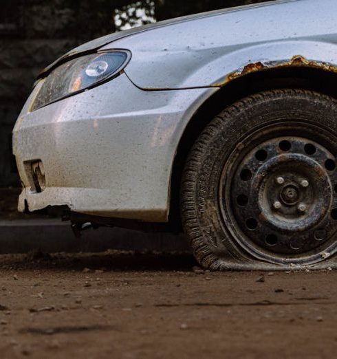 Depreciation - Abandoned Car with Flat Tire