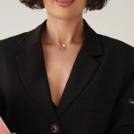 Leadership Styles - Confident Businesswoman Holding Pink Folder Indoors