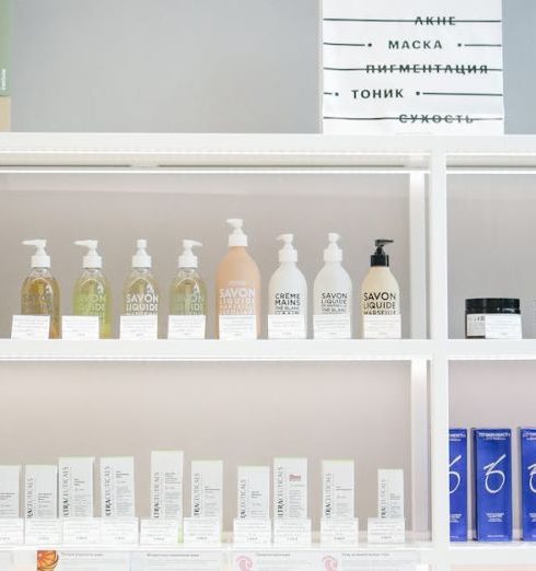 Product Lines - Well-organized skincare product display on shelves in a store setting.