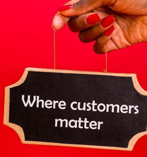 Customer Value - A hand holding a sign with the text 'Where customers matter' against a red background.