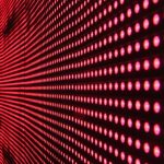 Digital Transformation - Vibrant abstract pattern of illuminated red LED lights forming a dynamic design.