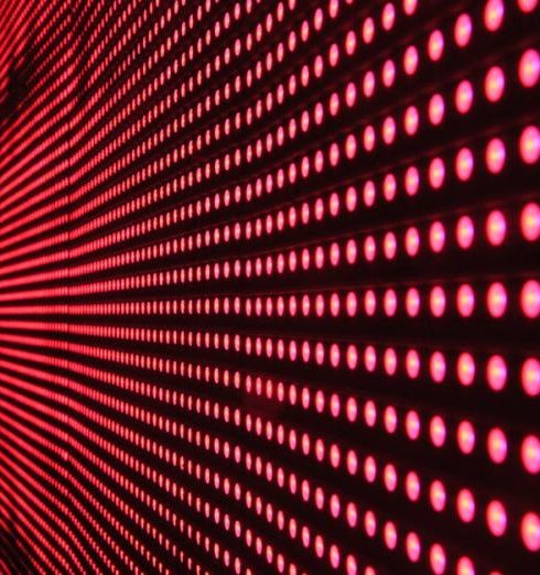 Digital Transformation - Vibrant abstract pattern of illuminated red LED lights forming a dynamic design.