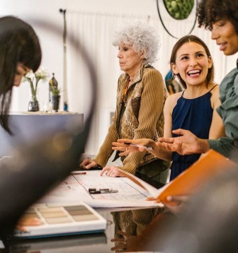 Product Demand - A group of diverse businesswomen having an interactive meeting in a modern office setting.