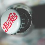 Brand - Close-up top view of an open Pepsi Cola glass bottle showcasing its iconic branding.