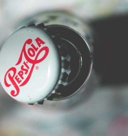 Brand - Close-up top view of an open Pepsi Cola glass bottle showcasing its iconic branding.