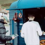 Repeat Customers - Customers in Front of a Mobile Cafe that Also Sells Vinyl Records