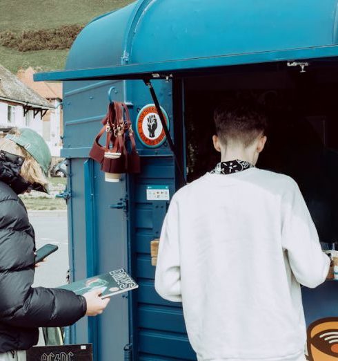 Repeat Customers - Customers in Front of a Mobile Cafe that Also Sells Vinyl Records