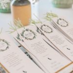 Referral Programs - Beautifully arranged wedding ceremony programs with floral decor in Portugal.