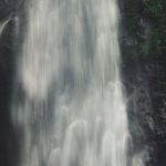 Satisfaction - Stunning waterfall surrounded by lush greenery in Tambakdahan, Indonesia.