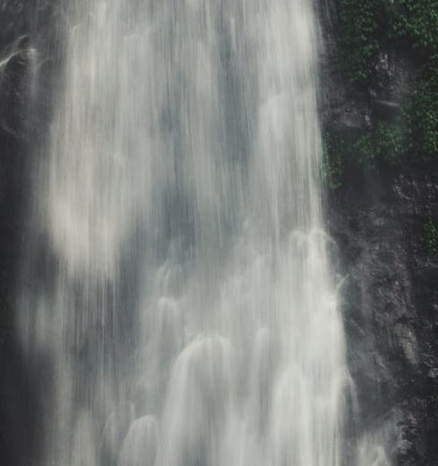 Satisfaction - Stunning waterfall surrounded by lush greenery in Tambakdahan, Indonesia.