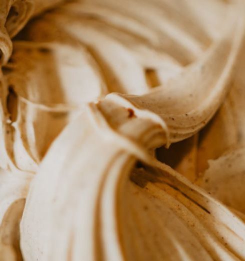 Churn - Delicious creamy ice cream swirls in a close-up shot, showcasing its rich texture and inviting look.