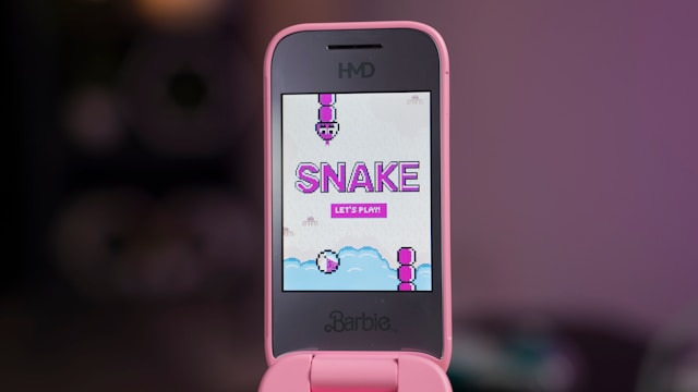 a-pink-smart-phone-with-a-snake-on-the-screen